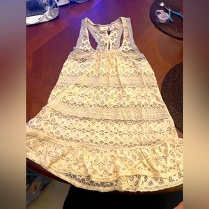 Day Trip Size M sleeveless lace top. See through. Soft with bows on back.